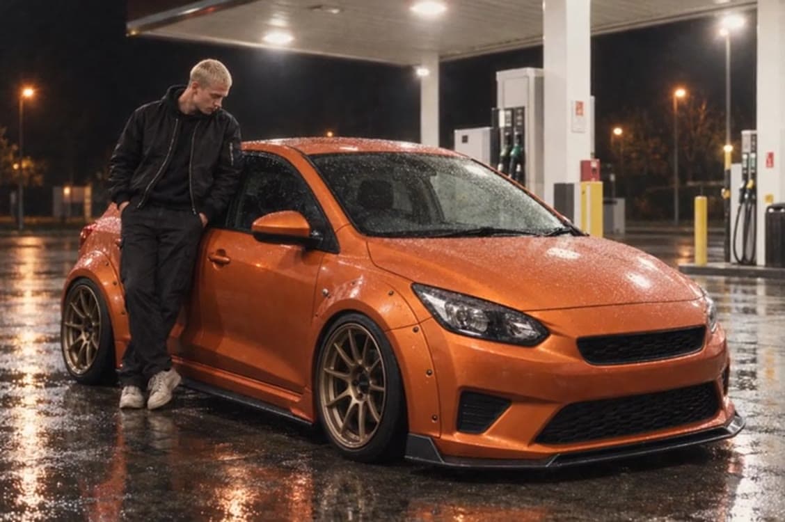 A user’s silver hatchback restyled in orange with a body kit