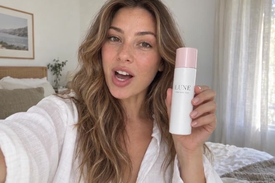 A creator holding a skincare bottle in a UGC-style ad