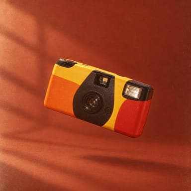 Product photo: a yellow disposable camera